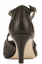 Back view of the Stella. A black leather high heel with two delicate straps that crisscross over the front. This two and a half inch heel has a pointed toe and two small buckles on the straps. Available in wide width and extra wide widths.