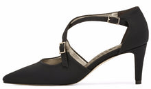 Side view of the Stella. A black micro fabric high heel with two delicate straps that crisscross over the front. This two and a half inch heel has a pointed toe and two small buckles on the straps. Available in wide width and extra wide widths.