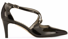 Side view of the Stella. A black patent leather high heel with two delicate straps that crisscross over the front. This two and a half inch heel has a pointed toe and two small buckles on the straps. Available in wide width and extra wide widths.