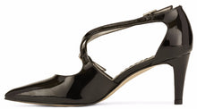 Side view of the Stella. A black patent leather high heel with two delicate straps that crisscross over the front. This two and a half inch heel has a pointed toe and two small buckles on the straps. Available in wide width and extra wide widths.