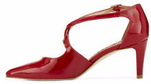 Side view of the Stella. A red patent leather high heel with two delicate straps that crisscross over the front. This two and a half inch heel has a pointed toe and two small buckles on the straps. Available in wide width and extra wide widths.